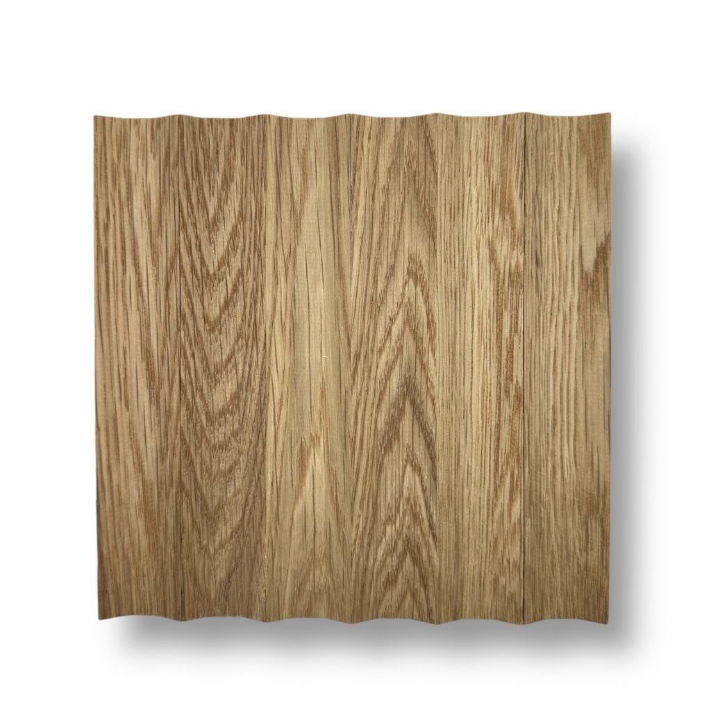 Wide plank wood panel with a light brown finish, wavy edge design, and natural grain. Perfect for modern interiors by Surfacing Solution. | Custom tambour and architectural wood specialists