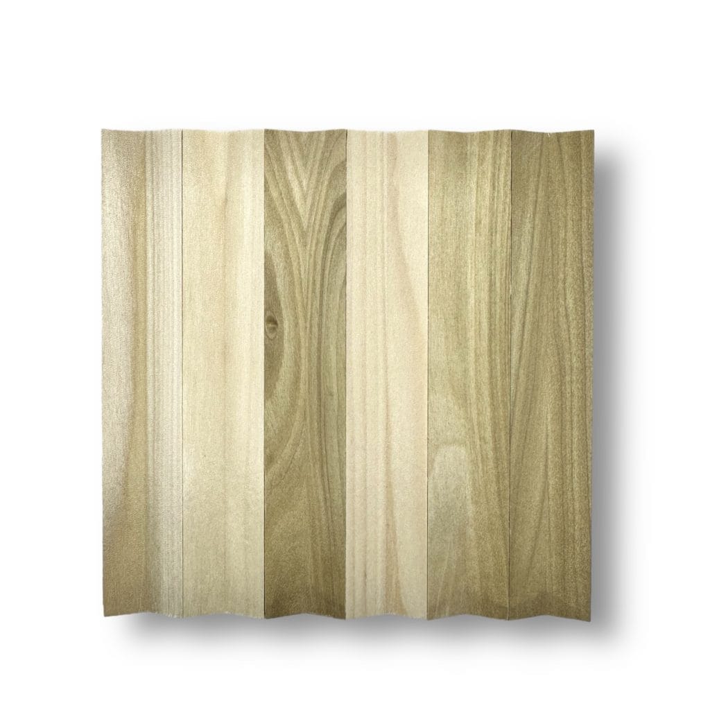 Flexible wood tambour panel with six light brown and beige strips, natural grain, shown on a white background—ideal wall surfacing. | Custom tambour and architectural wood specialists