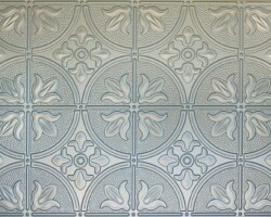 Silvery gray embossed tiles with geometric patterns add texture and sheen beside fluted tambour wood panels—ideal for modern interiors. | Custom tambour and architectural wood specialists Silvery gray embossed tiles with geometric patterns add texture and sheen beside fluted tambour wood panels—ideal for modern interiors. | Custom tambour and architectural wood specialists