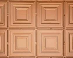 Copper-finished decorative panel with raised geometric squares and circular details, ideal for wall or ceiling accents with tambour panels. | Custom tambour and architectural wood specialists Copper-finished decorative panel with raised geometric squares and circular details, ideal for wall or ceiling accents with tambour panels. | Custom tambour and architectural wood specialists