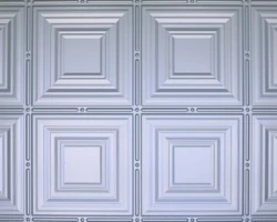 Glossy white tambour wall panel with geometric raised concentric squares, linear ridges, and circular accents for modern interiors. | Custom tambour and architectural wood specialists Glossy white tambour wall panel with geometric raised concentric squares, linear ridges, and circular accents for modern interiors. | Custom tambour and architectural wood specialists